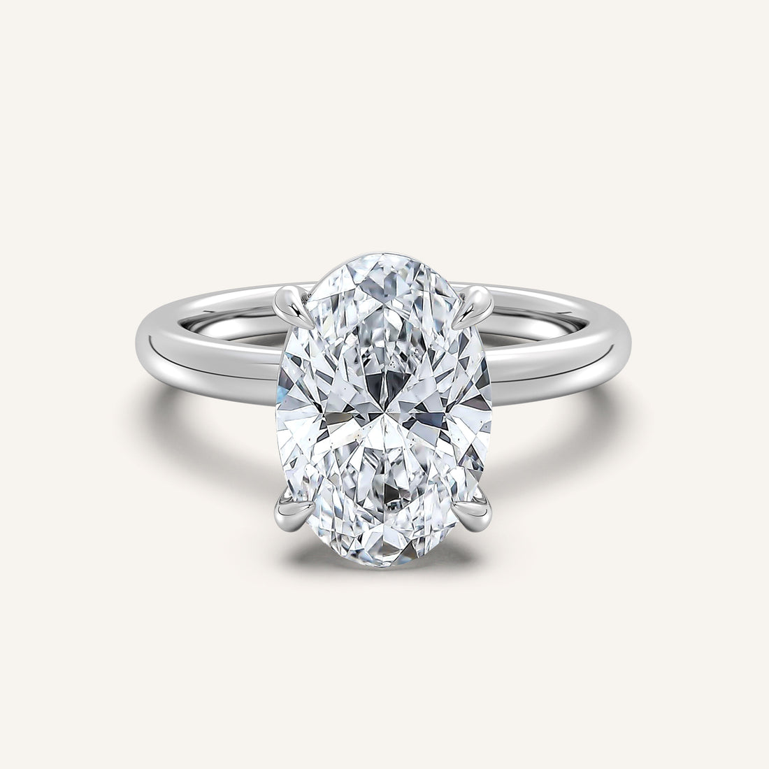 Oval lab-grown diamond solitaire engagement ring in 14k white gold, the classic setting for a 2 carat stone