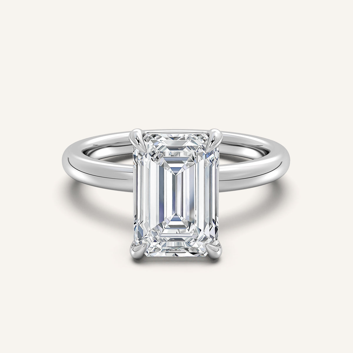 Emerald cut solitaire engagement ring in 14k white gold, the step cut whose long facets show clarity most