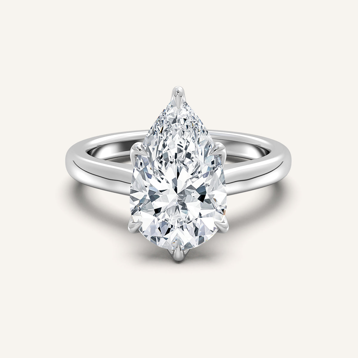 Pear shaped lab-grown diamond tulip style cathedral engagement ring in 14k white gold