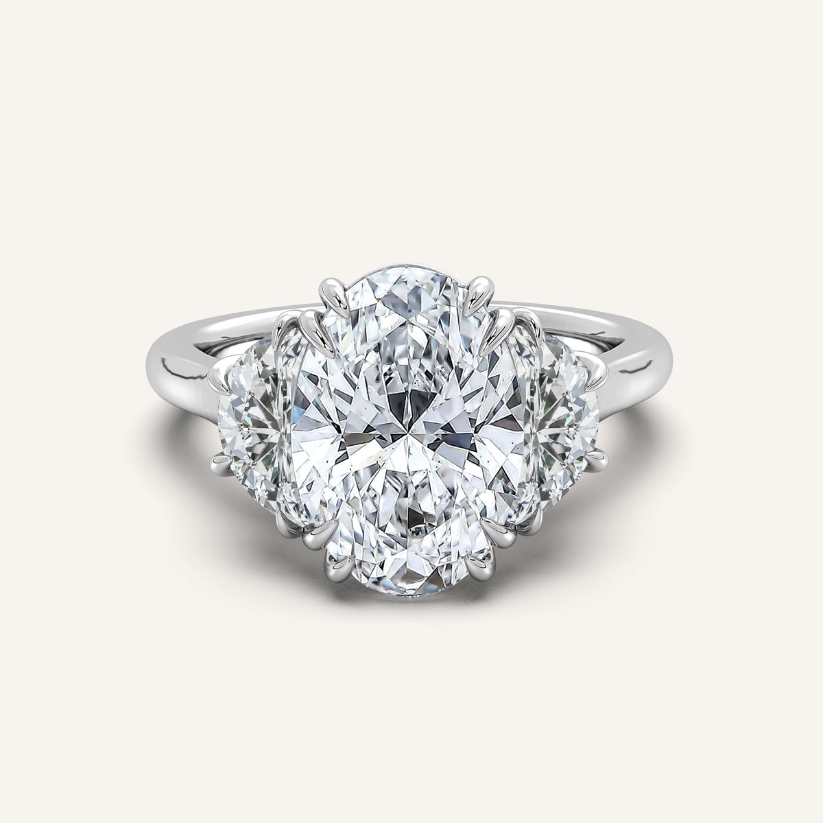 Oval lab-grown diamond three stone engagement ring with crescent side stones in 14k white gold