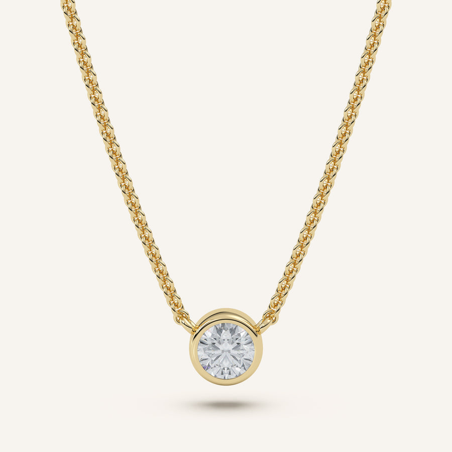 Round bezel diamond necklace in 14k yellow gold