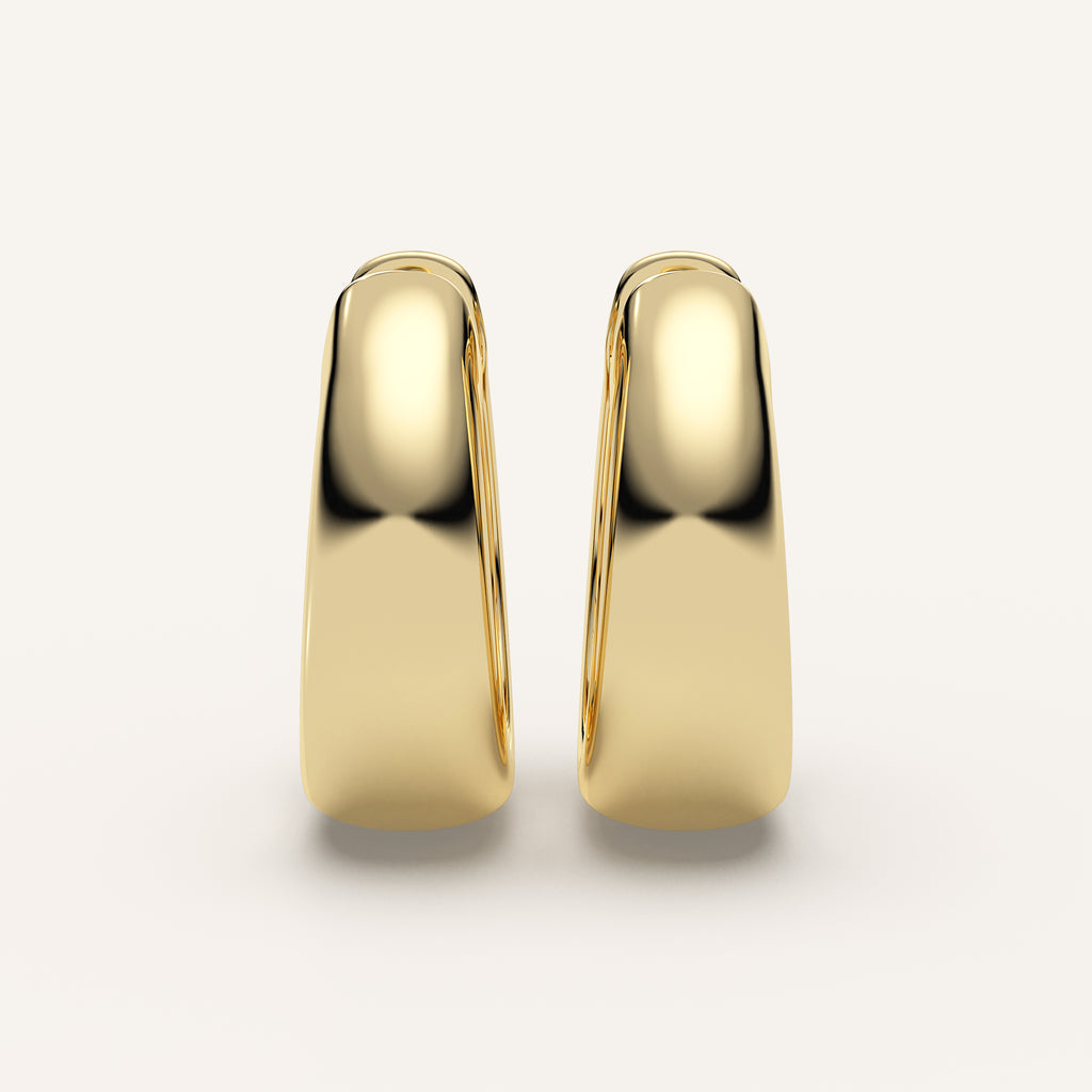 Chunky Gold Huggie Earrings in 14k Yellow Gold (view 1)
