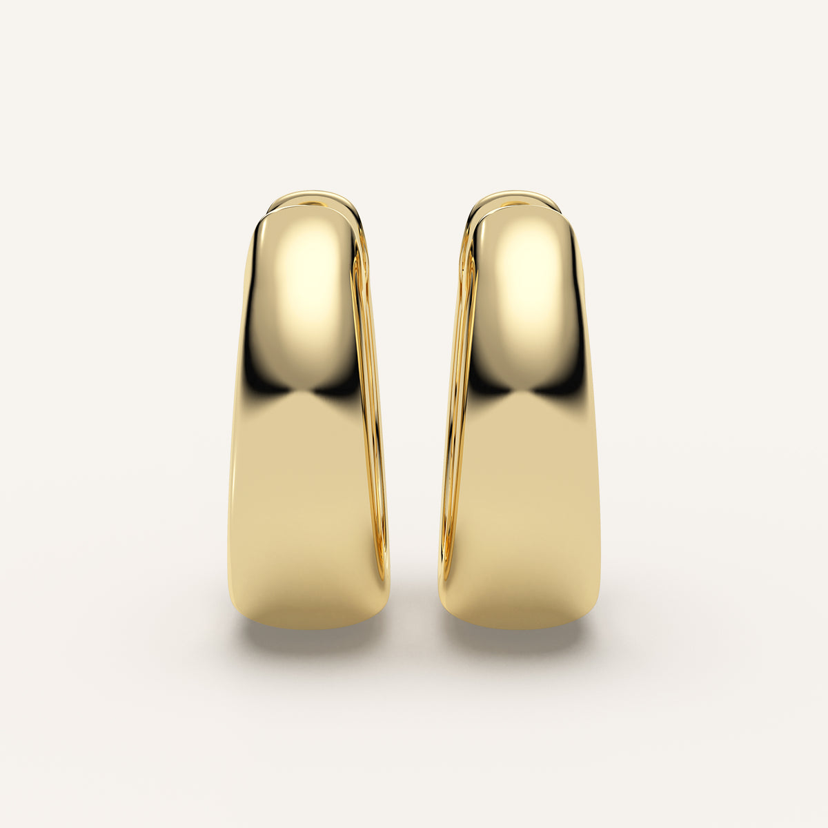 Chunky Gold Huggie Earrings in 14k Yellow Gold (view 1)