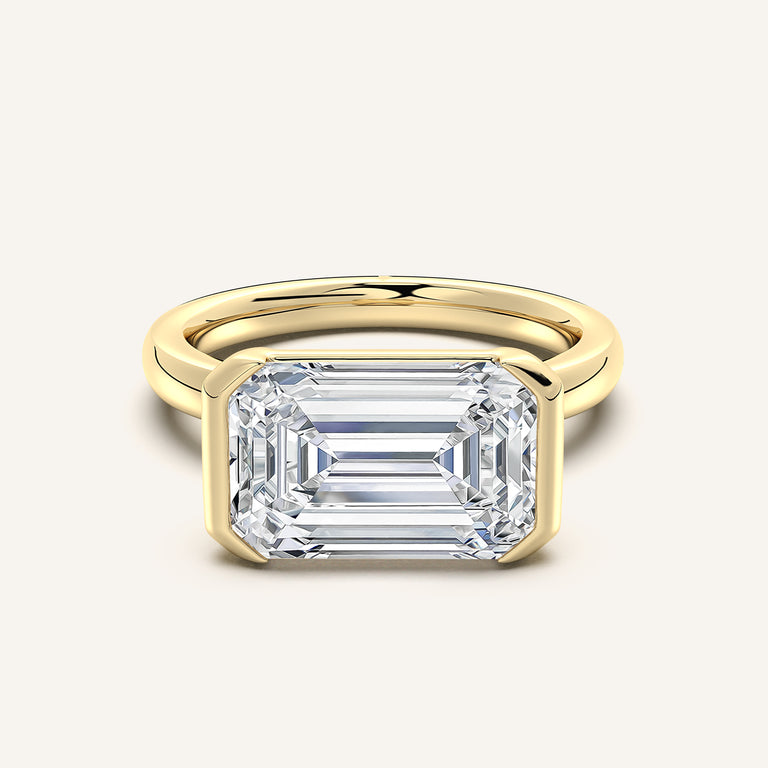 Emerald Cut East West Half Bezel Ring in 18k Yellow Gold