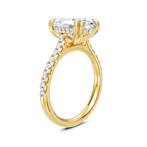 Elegant yellow gold engagement ring with lab-grown diamond center and side stones, ethical and sustainable design