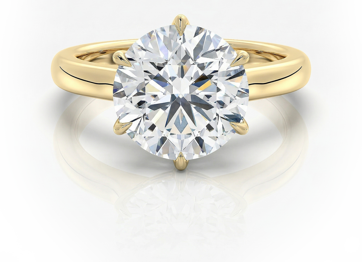 Round lab-grown diamond engagement ring in yellow gold, ethical and conflict-free