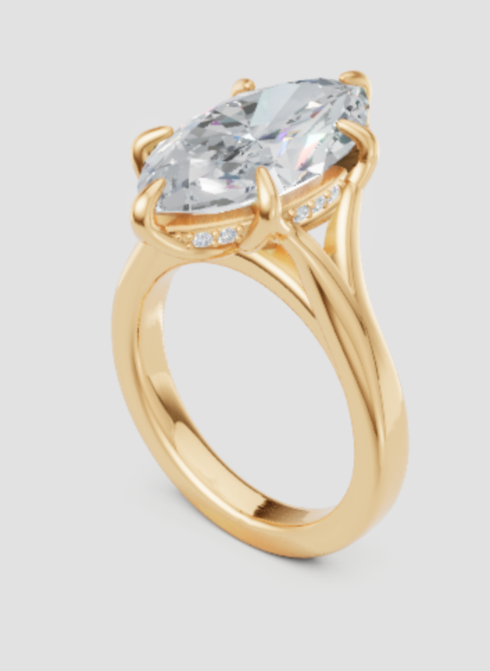Elegant marquise lab-grown diamond engagement ring in gold with side accents