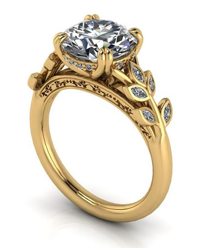 Elegant gold engagement ring with lab-grown diamond and leaf-inspired side accents