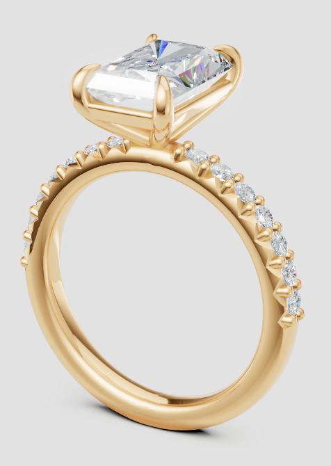 Lab-grown diamond engagement ring with radiant cut center stone and pave band in yellow gold