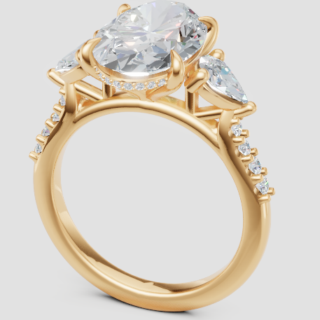 Elegant lab-grown diamond engagement ring with pear side stones and gold band, eco-friendly & conflict-free