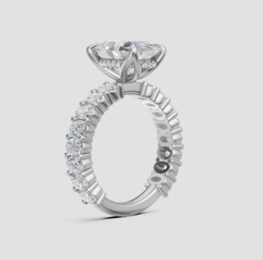 Lab-grown diamond engagement ring with marquise center stone and pave band, eco-friendly and conflict-free