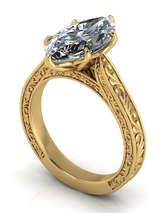 Elegant marquise lab-grown diamond engagement ring in yellow gold with intricate filigree band