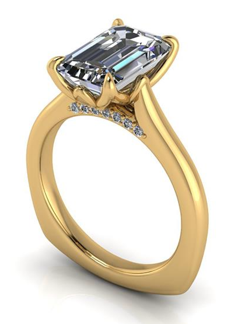 Elegant emerald cut lab-grown diamond engagement ring in yellow gold with diamond accents