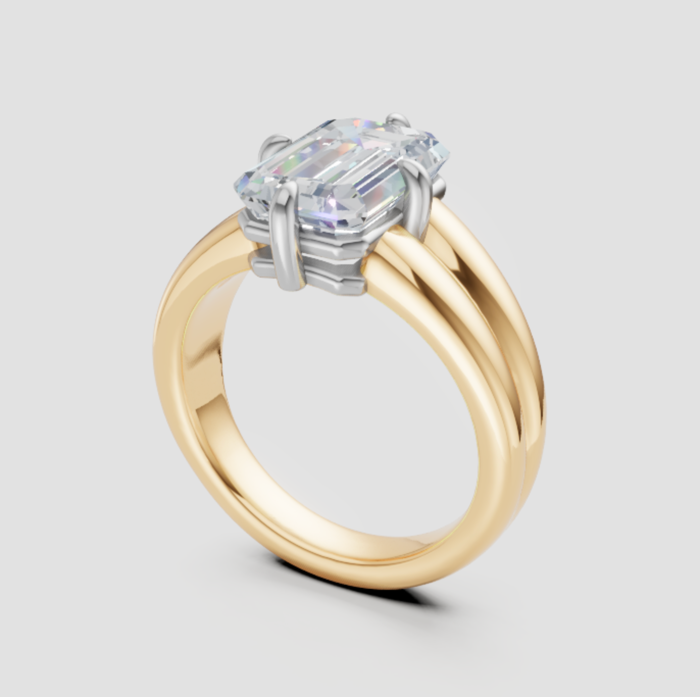 Elegant emerald cut lab-grown diamond engagement ring in yellow gold with white gold prongs