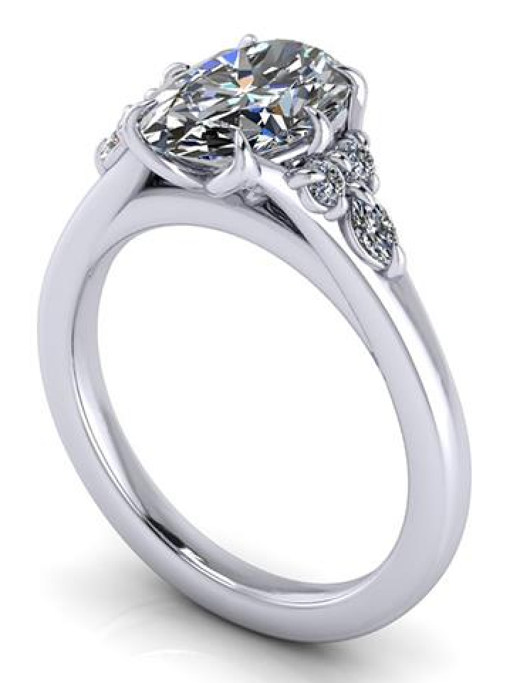Oval lab-grown diamond engagement ring with side accents, ethical and sustainable design