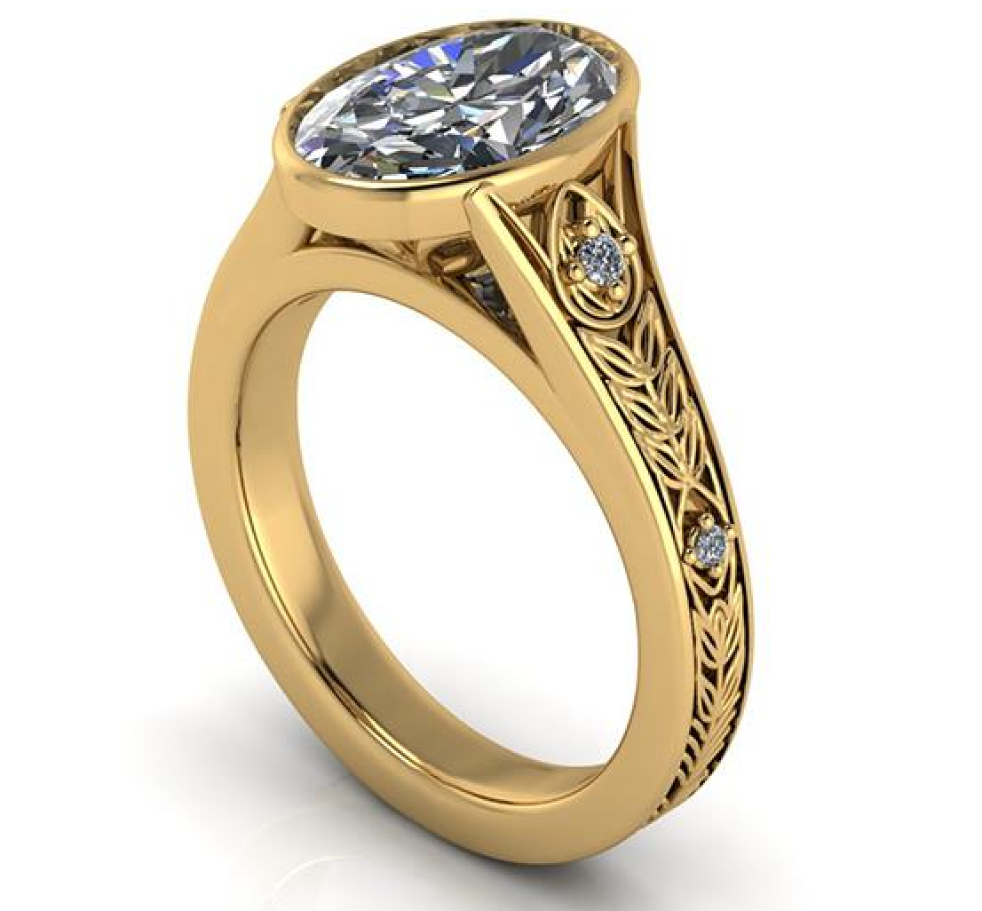 Elegant gold engagement ring with oval lab-grown diamond and leaf filigree details
