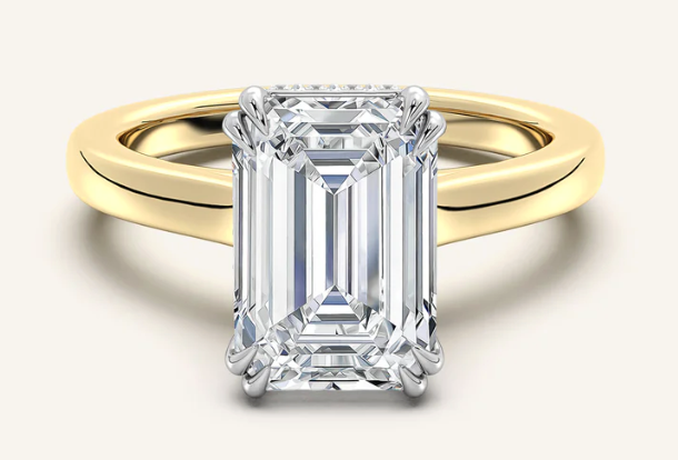 Elegant emerald-cut lab-grown diamond engagement ring in yellow gold, showcasing brilliance and ethical craftsmanship.