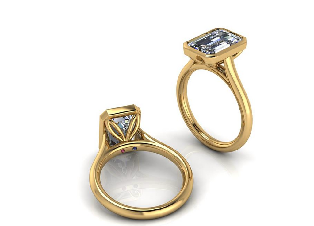 Two gold rings with diamond accents on a white background