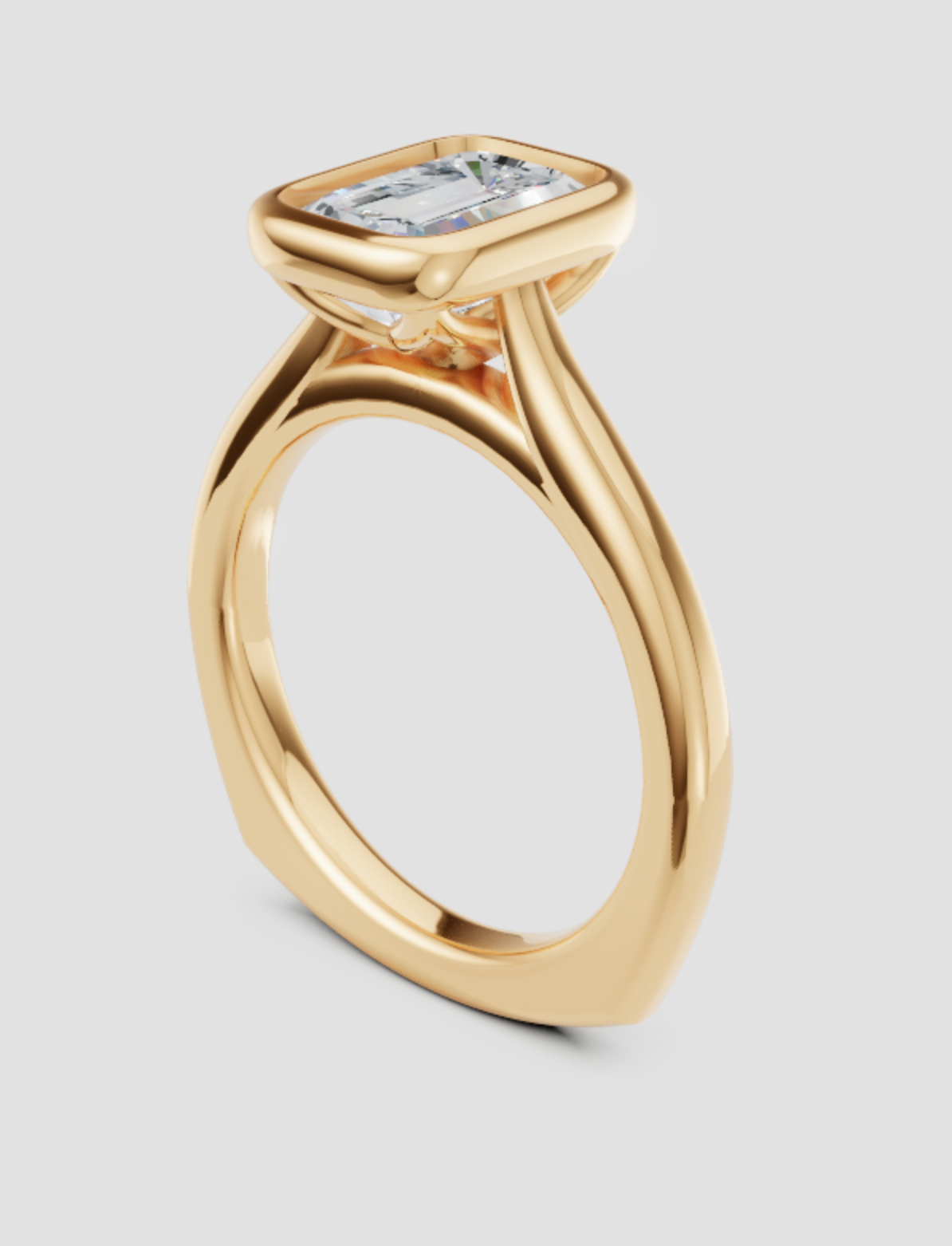 Gold ring with a diamond on a light gray background