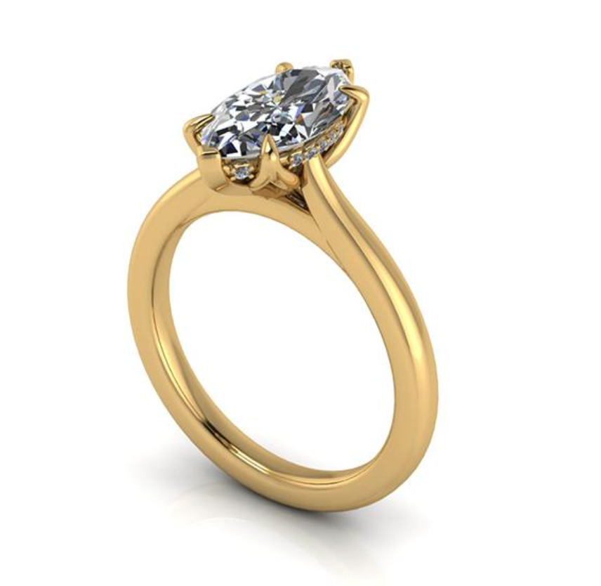 Gold ring with a diamond on a white background