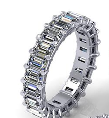 Silver ring with emerald-cut diamonds on a white background
