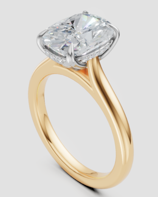 Gold ring with a large diamond on a light gray background