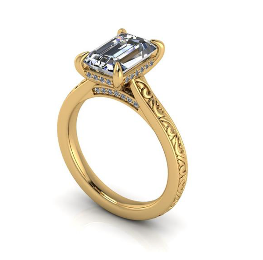 Gold ring with a large diamond and smaller diamonds on the band against a white background