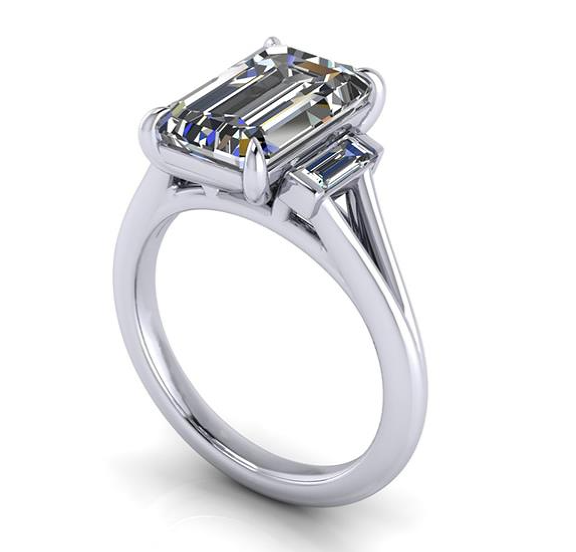 An emerald-cut diamond ring in a polished silver-colored metal setting, featuring a large center stone and smaller side stones, shown on a clean white background.