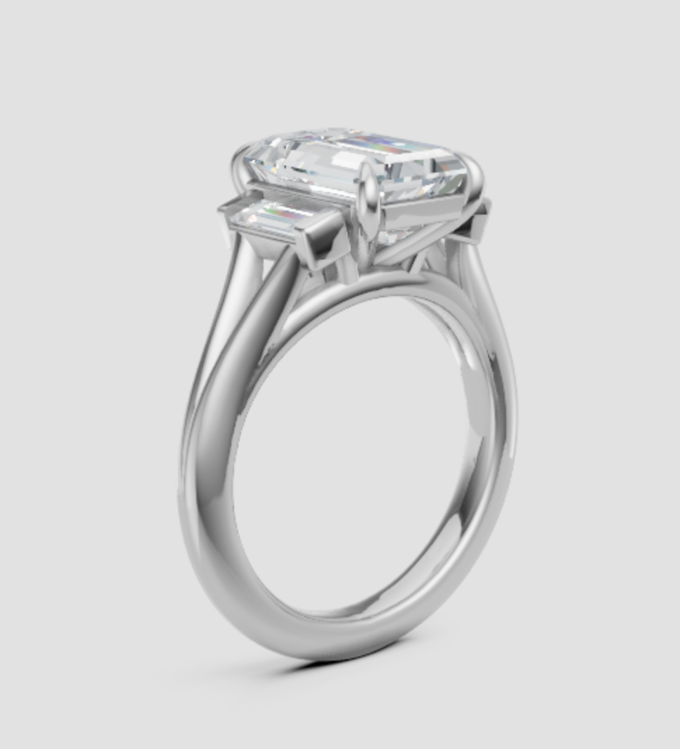 Elegant emerald cut lab-grown diamond engagement ring with side accents, ethical and sustainable design