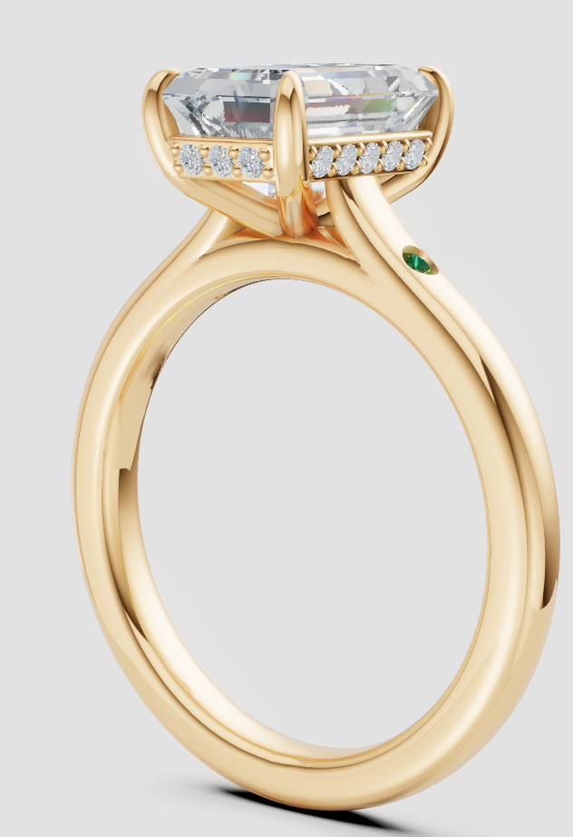 Elegant lab-grown diamond engagement ring in yellow gold with side accents and hidden green gem
