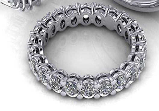Silver ring with diamonds on a white background