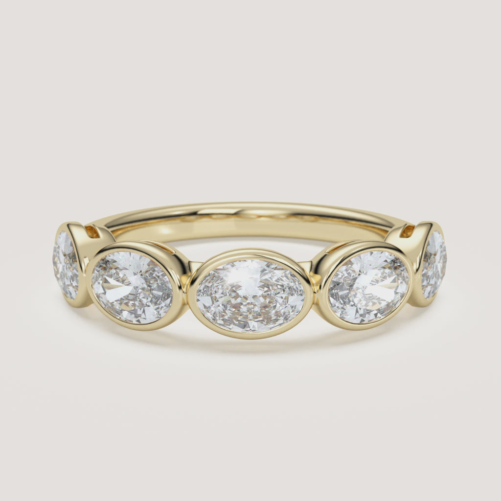 East-West Oval Bezel Half Eternity Band in 14k Yellow Gold (360° video)